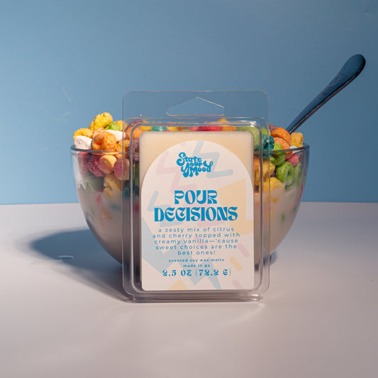 Break-apart Pour Decisions wax melts in front of a cereal bowl with spoon, nostalgic scent inspired by childhood breakfast