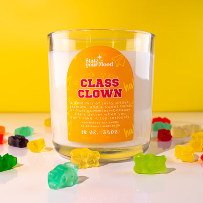 class clown soy wax candle in clear recyclable jar with bright, playful label design
